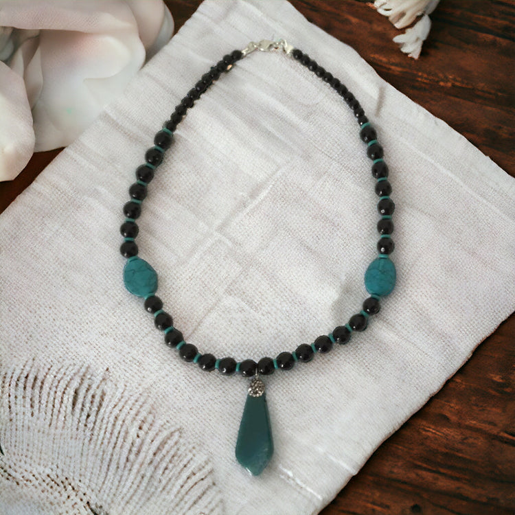 Handmade natural stoned, turquoise and black onyx necklace, with unique handcrafted glass pendant.