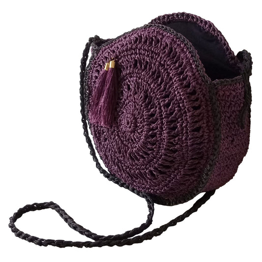 Hand crocheted and crafted paper rope, lined, purple macaron bag with tassle detail in front.