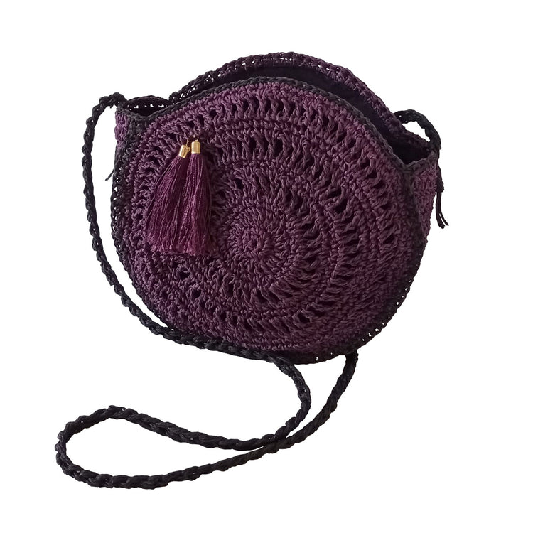 Hand crocheted and crafted paper rope, lined, purple macaron bag with tassle detail in front.