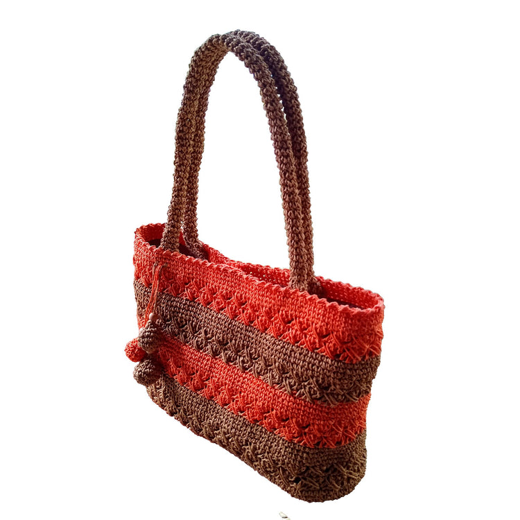 Hand made and crocheted lined, paper rope, brown and orange color tote, with swinging balls detail in front.