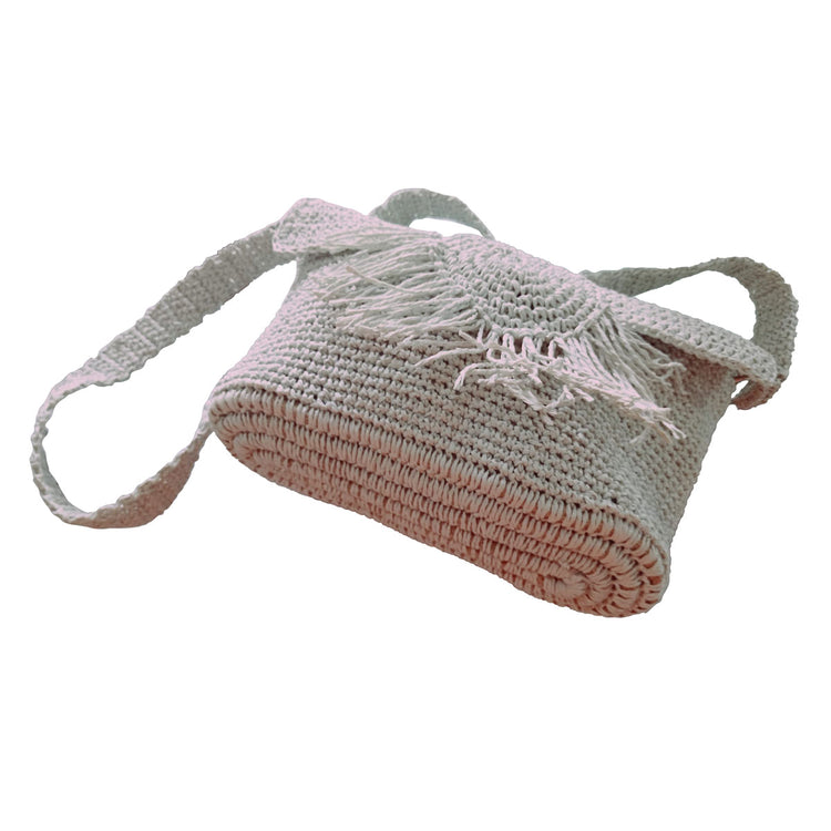 Handmade lined light grey wicker bag with tassel detail in front.