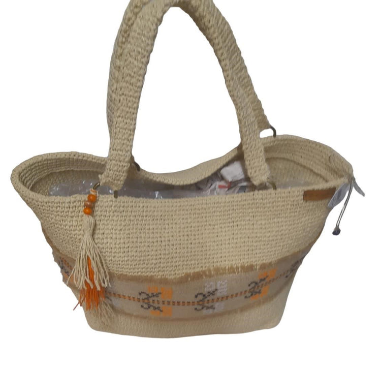 Handmade wicker large bag, with pocket detail inside, orange flowers embroidery detail with jute thread on wicker fabric around it.