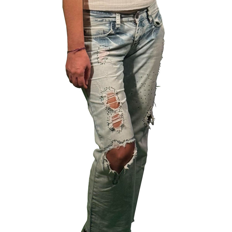 Specially designed, hand embroidered ripped jeans, the torn areas are hand embroidered with crystal shiny stones.