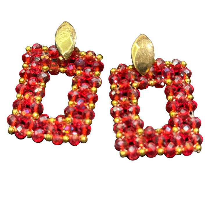 Very stylish handmade design earrings, consisting of red shiny crystal stones and gold color stones.