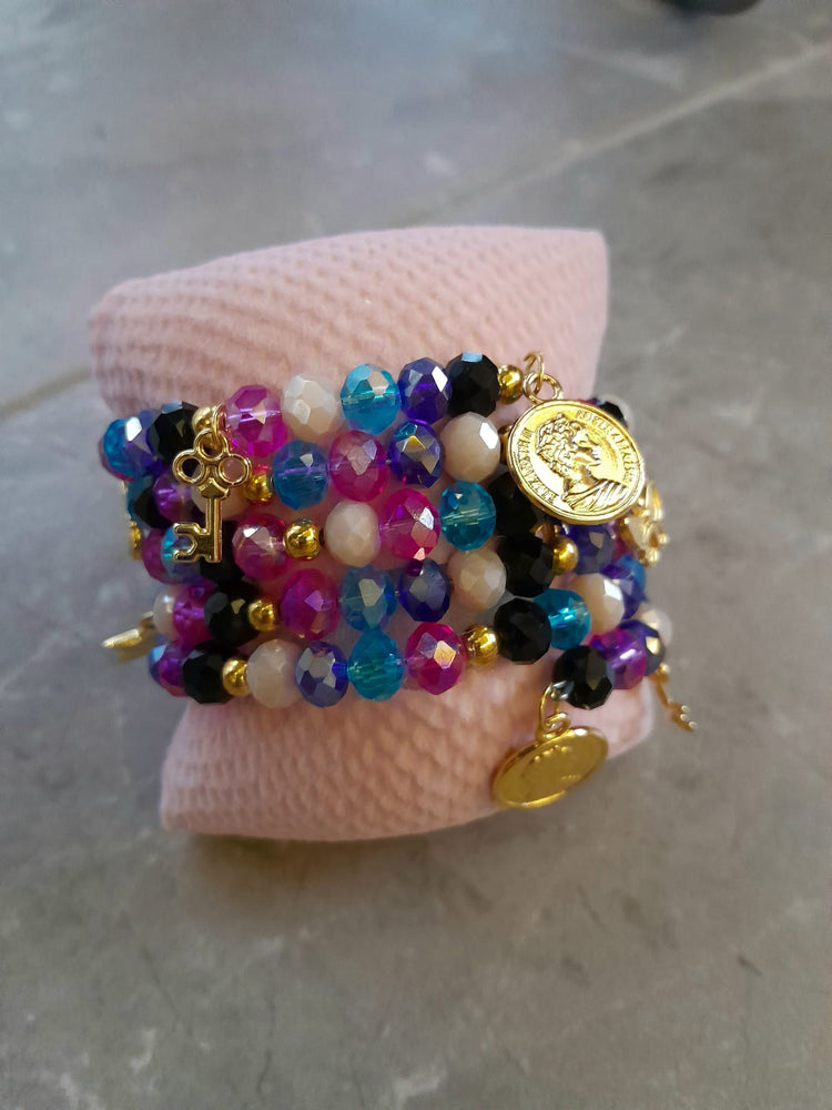 Handmade special design wrap bracelet, consisting of multicolored crystal stones and gold accessories.