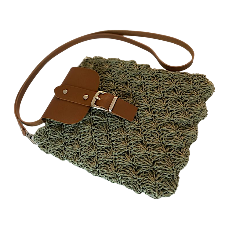 Handmade oyster pattern wicker bag with leather lid and strap.