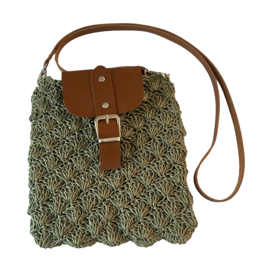 Handmade oyster pattern wicker bag with leather lid and strap.