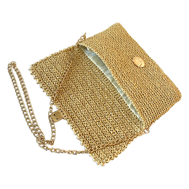 Handmade lined wicker clutch with gold chain strap.