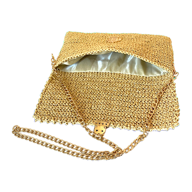 Handmade lined wicker clutch with gold chain strap.