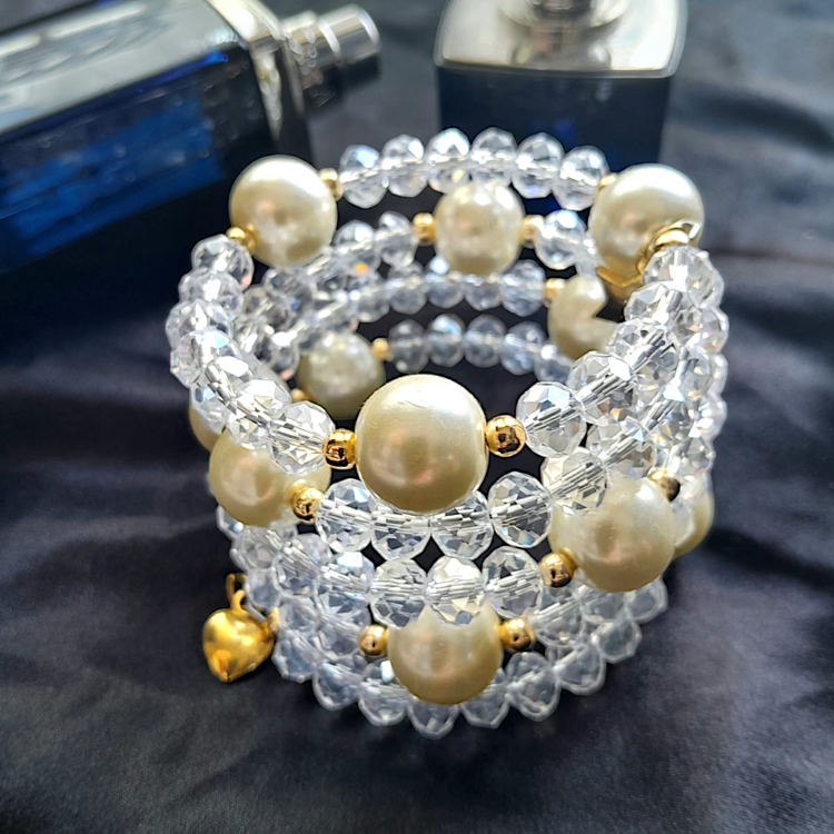 Handmade wrap bracelet consisting of crystal and gold accessory stones.