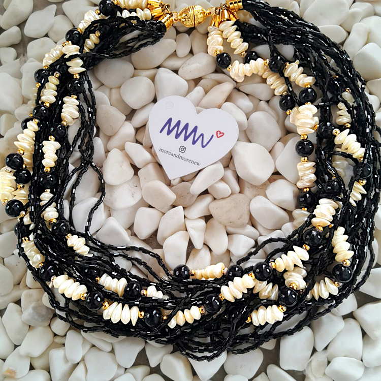 Handmade wrap necklace consisting of natural and genuine mother-of-pearl stones