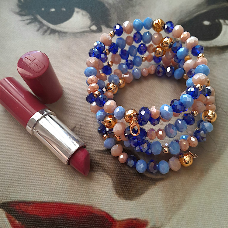 Handmade, special design blue and gold bracelet, made of crystals, brass plated stones and beads.