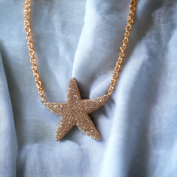 Handmade brass plated hand embroidery crystal star necklace.