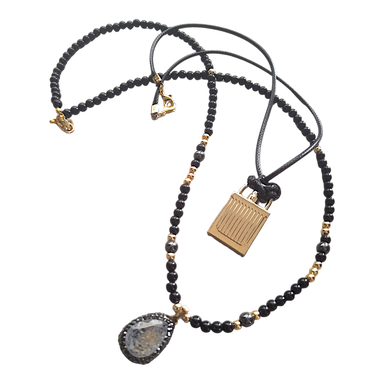 Specially designed, handmade double necklace with black and gold beads and gray crystal.